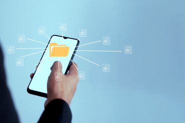 Foto: Mobiltelefon mit Akten Icon